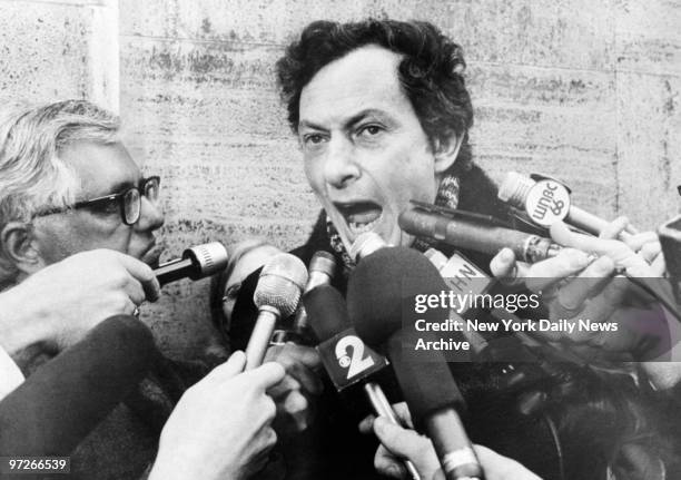 Fiction writer Clifford Irving talks to reporters after serving 16 months in prison for writing a fake autobiography of Howard Hughes.