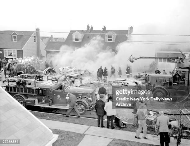 Bomber Crashes in Street. A B-26 bomer burns furiously in street and on lawn outside 61 Barbara Drive in East Meadow, L.I.. Causing auto and home to...