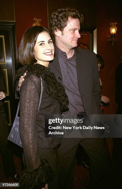 Colin Firth and wife Olivia arrive for the premiere of the movie "Shakespeare in Love" at the Ziegfeld Theater. Firth is in the film.