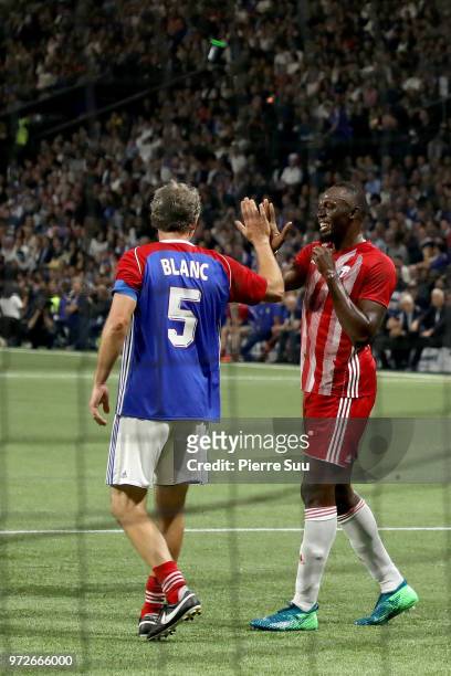 Sprinter Usain Bolt is seen with Laurent Blanc during the France 98 versus Fifa 98 football match at U Arena on June 12, 2018 in Nanterre, France.