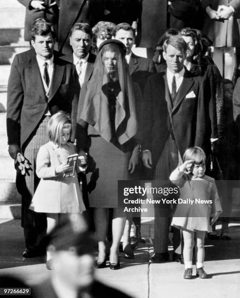 Letting go of his mother's hand, John F. Kennedy Jr. Salutes his father's flag-draped casket as it passes on November 25, 1963 -- the boy's third...