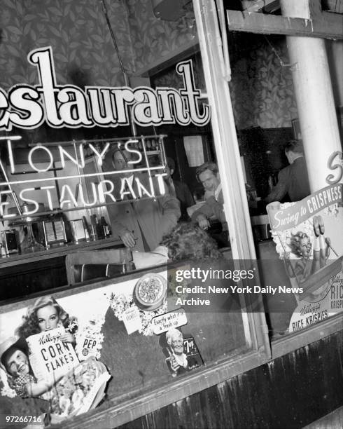 John Balfe looks down at his dead sweatheart, Anna Nelson after he fatally stabbed her in a restaurant booth. A cop sitting nearby arrested Balfe...