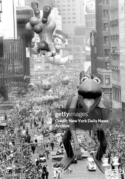 Look, up in the sky, it's Kermit, topsy-turvy Ronald McDonald and Betty Boop astride crescent moon in the Macy's Thanksgiving Day Parade.