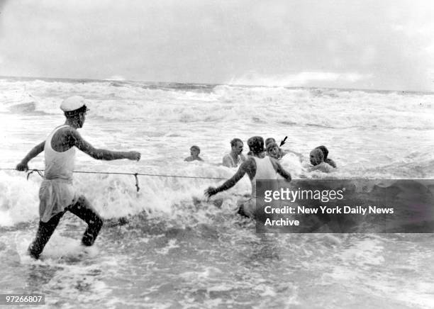 Morro Castle disaster in Spring Lake, New Jersey., Here arrow in picture shows a survivor being hauled into shallow water by rescuers. Coast...