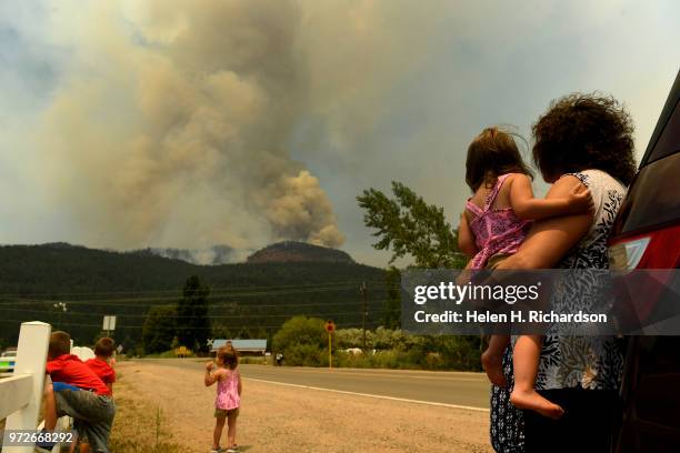 Barbara Simmons, right, holds her granddaughter Brynn Gammon while she and her other grandchildren from left to right Brody Blake, 4 and Brielle...