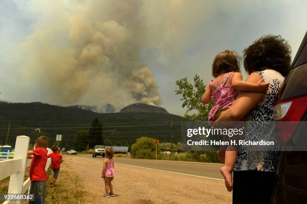 Barbara Simmons, right, holds her granddaughter Brynn Gammon while she and her other grandchildren from left to right Brody Blake, 4 and Brielle...
