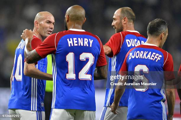 Zinedine Zidane, Thierry Henry and Christophe Dugarry of France 98 react during the friendly match between France 98 and FIFA 98 at U Arena on June...