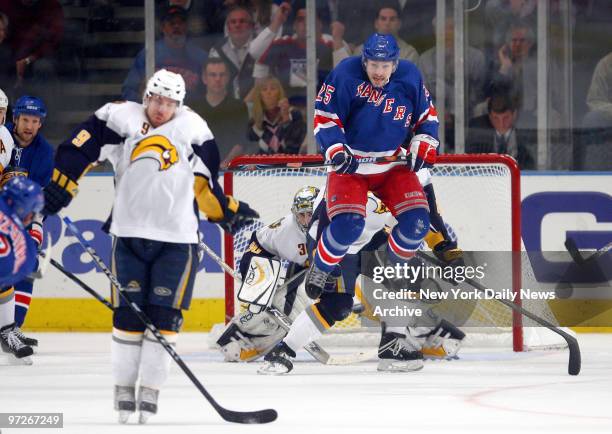 New York Rangers' Petr Prucha jumps to avoid a teammate's shot on goal during the first period of Game 3 of an Eastern Conference semifinal playoff...
