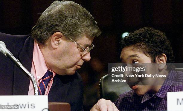 Comedian Jerry Lewis chats with Benjamin Cumbo of Upper Marlboro, Md., at congressional hearing in Washington. Lewis was seeking funds for muscular...