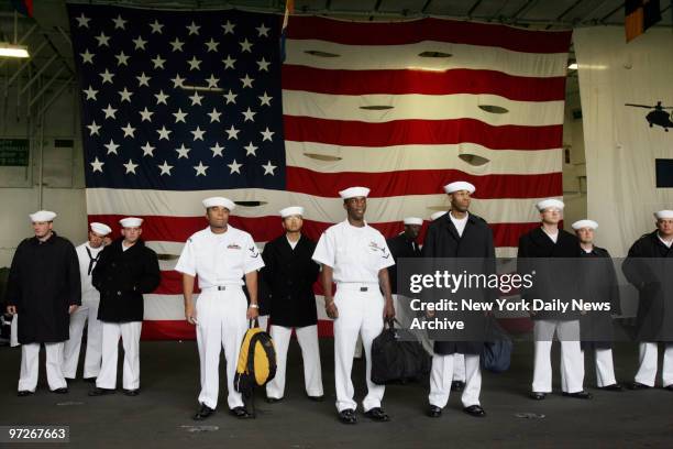 Sailors wait for liberty call aboard the aircraft carrier USS John F. Kennedy, which is in New York for the 18th Annual Fleet Week celebration taking...