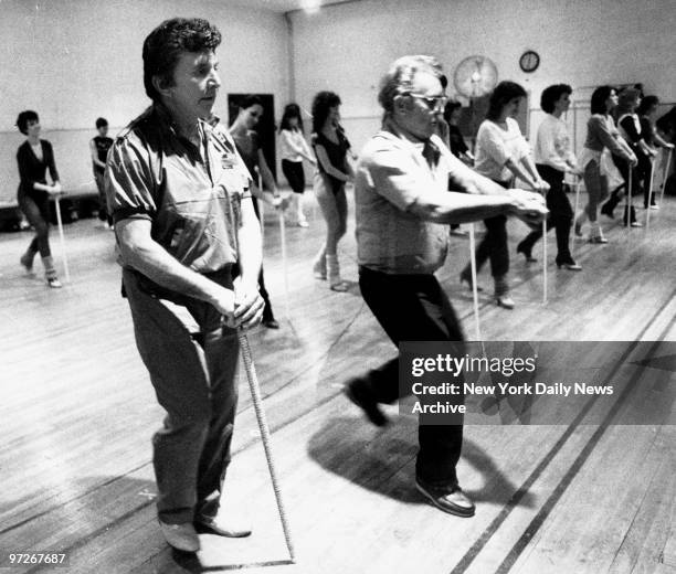 Liberace rehearses with the Radio City Music Hall "Rockettes" for his upcoming show.