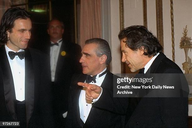 Film director Martin Scorcese is flanked by actors Daniel Day-Lewis and Harvey Keitel at an American Museum of the Moving Image salute to Scorsese at...