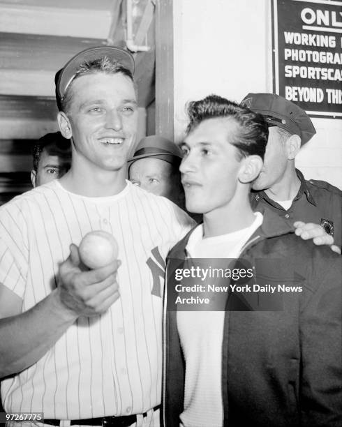 Sal Durante presents Roger Maris of the New York Yankees with the ball he laced 360 feet for his 61st homer of the year against the Boston Red Sox on...