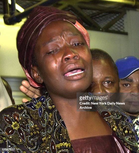 Salimata Sanfo, the widow of slain West African immigrant Ousmane Zongo, weeps during a visit to Chelsea Mini-Storage on W. 27th St., where her...