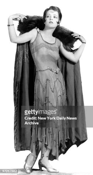 Film star Clara Bow models for the camera.