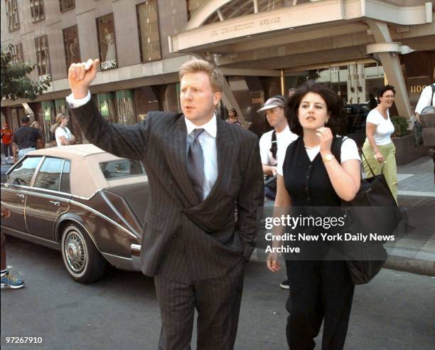 Monica Lewinsky leaving the office of lawyer Plato Cacheris on Connecticut Ave. She is accompanied by Cacheris' partner Preston Burton who hailed her...