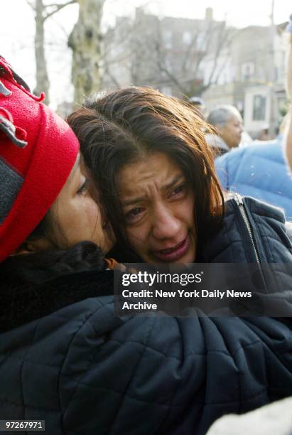 Monica Orellana is comforted by a friend after her 5-year-old son, Christian Plaza, was killed by a car that jumped the curb as she was walking him...