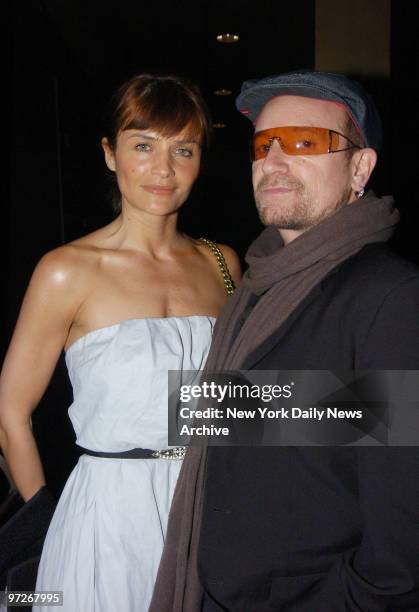 Bono arrives with friend Helena Christensen at the Tribeca Grand Hotel screening room for the Cinema Society's screening of the movie "Zodiac."