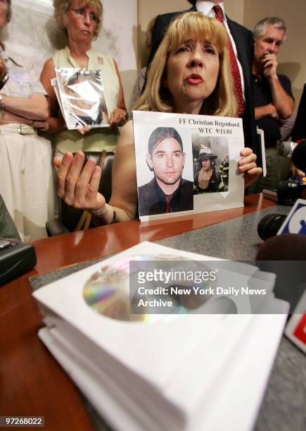 Sally Regenhard holds photographs of her son, Firefighter Christian Regenhard, who was killed in the World Trade Center attacks on 9/11, at a news...