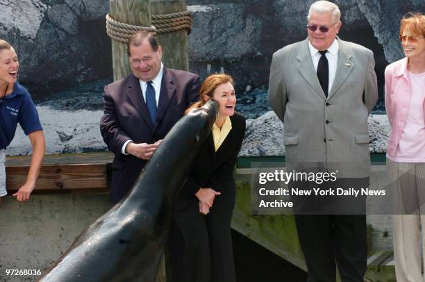 Cristyne Nicholas, president of NYC & Company, the city's tourism bureau, gets the seal of approval from a sea lion at the New York Aquarium in Coney...