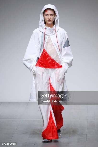 Model walks the runway at the Christopher Raeburn show during London Fashion Week Men's June 2018 at the BFC Show Space on June 10, 2018 in London,...