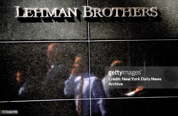 Financial giant Lehman Brothers - yet another leading financial institution - to go bust. Former employees leave the headquarters at 745 7th Avenue