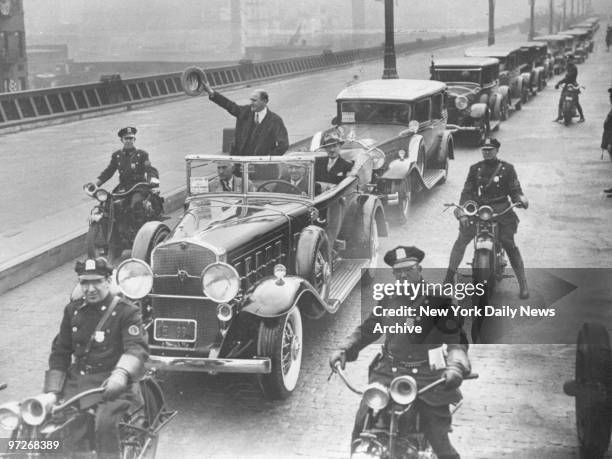 Borough President Julius Miller waves from open car in parade that marks the opening of the West Side Highway.