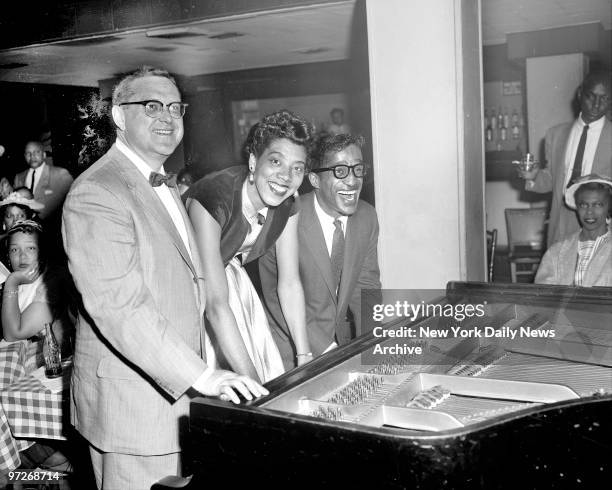 Sam Levenson, Althea Gibson and Sammy Davis Jr., at piano at a Bon Voyage party for Althea at Birdland Nightclub. Althea leaves for tennis matches at...
