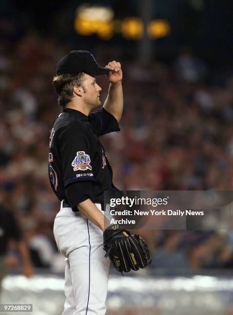 New York Mets' starter Shawn Estes watches the the ball go over the fence as he gives up a two-run homer in the fifth inning against the Montreal...