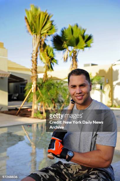 Interrview with Mets Carlos Beltran in the batting cage behind his house. Portrait in his backyard.