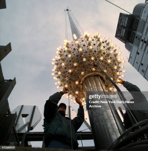 Lighting technicians Brian Sperazza and Carlos Freire prepare the New Year's Eve ball in Times Square.