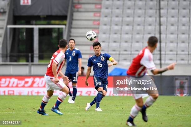 Hotaru Yamaguchi of Japan in action during the international friendly match between Japan and Paraguay at Tivoli Stadion on June 12, 2018 in...