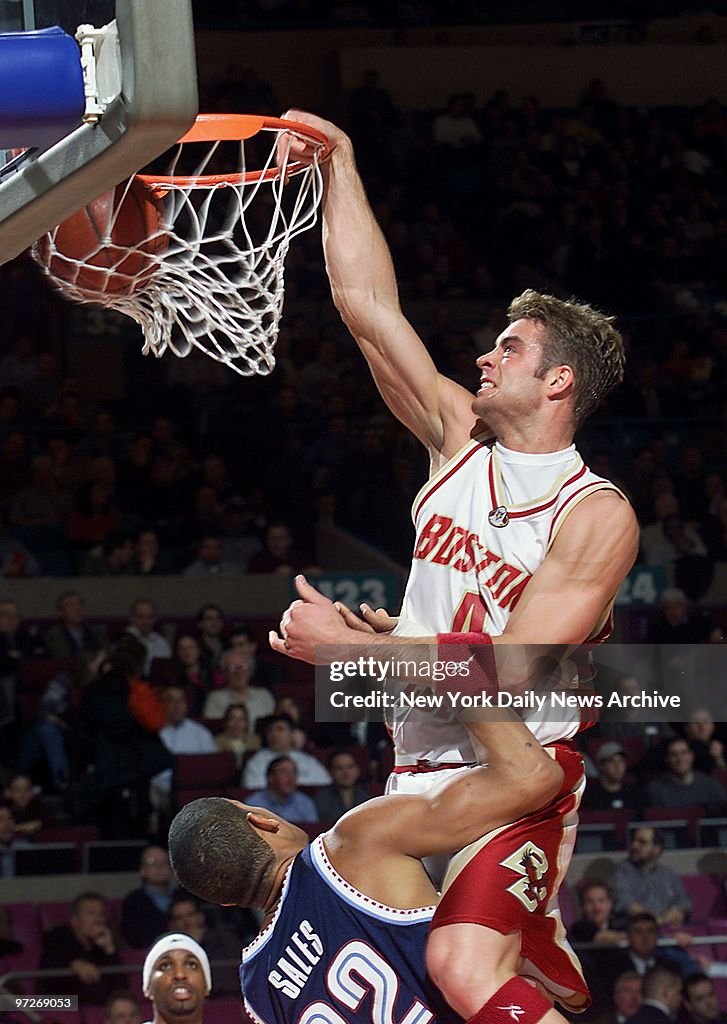 Boston College's Jonathan Beerbohm reaches over the rim to p