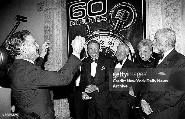 Morley Safer leads Mike Wallace, Don Hewitt, Lesley Stahl and Ed Bradley in song during a 25th anniversary party for "60 Minutes" at the Metropolitan...