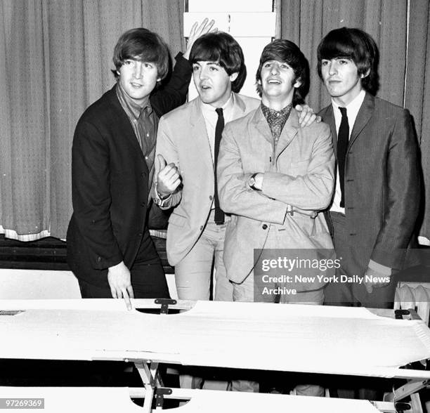 The Beatles, John Lennon, Paul McCartney, Ringo Starr and George Harrison stand in the Paramount Theatre at Times Square where they gave a benefit...