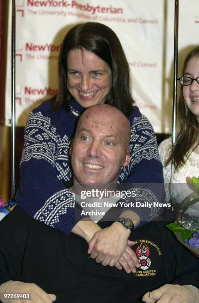 Fire Lt. Stephen Halliday and wife Linda share a smile as they leave Weill Cornell Medical Center. Halliday suffered second and third-degree burns to...