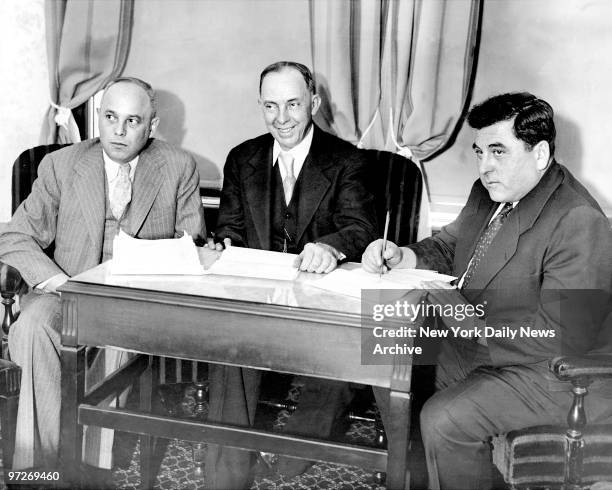 Samuel Leibowitz, George W. Chamlee and Joseph R. Brodsky , the defense counsel for the Scottsboro trial in conference at Tutwiler Hotel in...