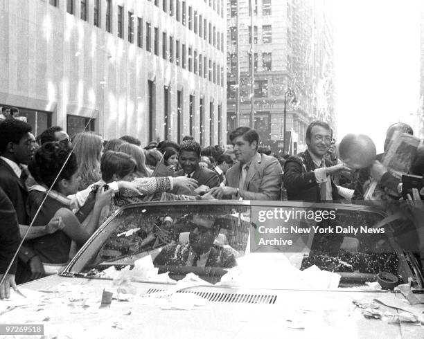 Motorcade with Tom Seaver [l.] and Jerry Koosman going up Broadway at the ceremony and parade for the New York Mets' after they defeated the...