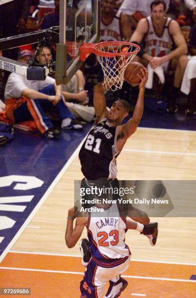 San Antonio Spurs Tim Duncan has the ball as New York Knicks' Marcus Camby looks on in Game 5 of the NBA Finals at Madison Square Garden. Spurs won...