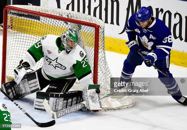Mike McKenna of the Texas Stars stops a shot against Colin Greening of the Toronto Marlies during game 6 of the AHL Calder Cup Final on June 12, 2018...