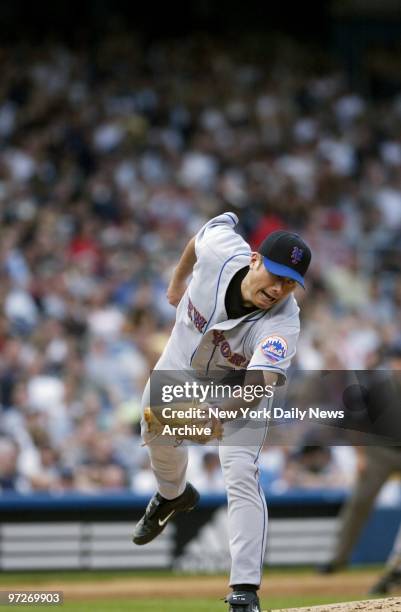 New York Mets' starting pitcher Jae Seo lunges for a ball hit out to center field by New York Yankees' Juan Rivera during the third game of the...