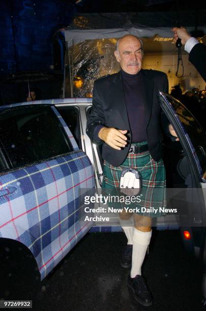 Sean Connery exits a plaid-schemed car as he arrives for the Johnnie Walker Dressed to Kilt fashion show and charity event at the Synod House at St....