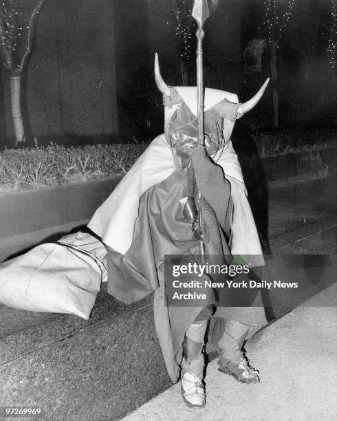 Moondog sitting on wall at the corner of CBS at 53d St. And Sixth Ave. In Manhattan. Moondog is a blind musician and makes all his clothes from old...