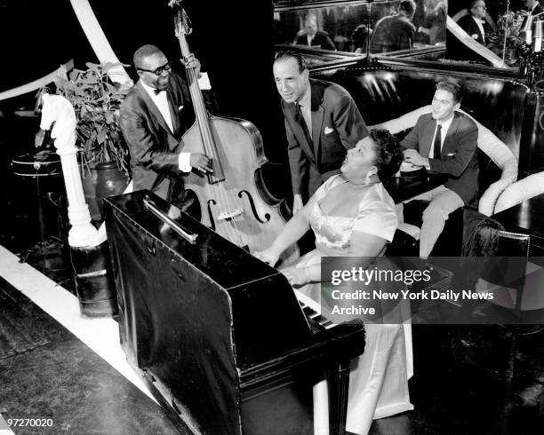 The Blue Angel, a supper club on E. 55th St. In Manhattan, where Martha Davis, spouse Cavin Ponder with owner Herbert Jacoby, play for an early...