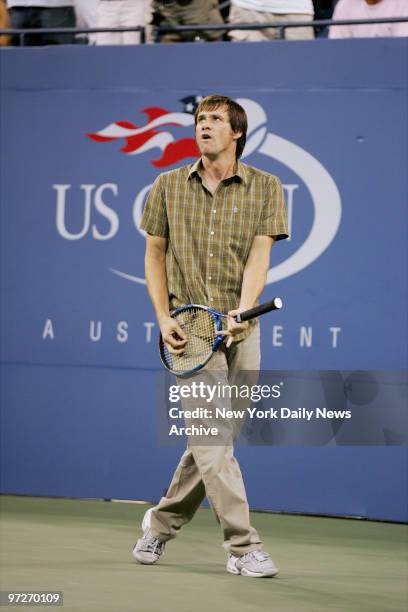 Comic-actor Jim Carrey entertains the crowd at Arthur Ashe Stadium in Flushing Meadows-Corona Park between matches of the 2005 U.S. Open.