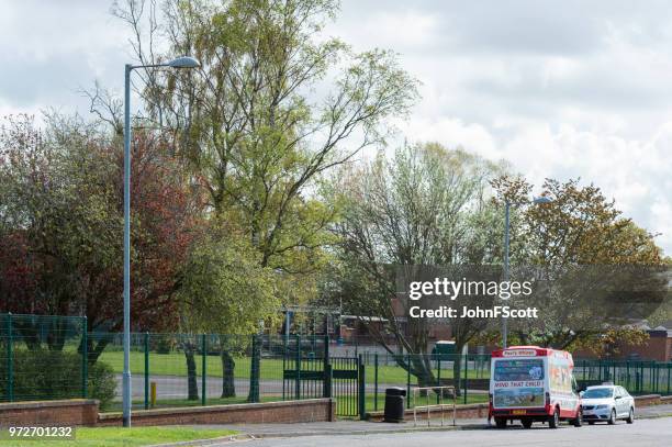 mobile ice cream van outside a school - johnfscott stock pictures, royalty-free photos & images