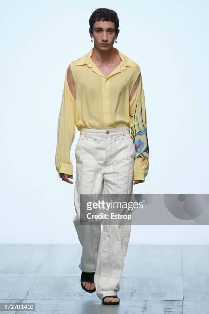 Model walks the runway at the Alex Mullins show during London Fashion Week Men's June 2018 at the BFC Show Space on June 10, 2018 in London, England.