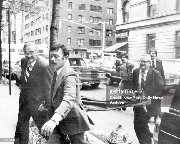 The body of John Lennon is taken into Frank E. Campbell funeral home, Madison Ave. And 81st St. In body bag.