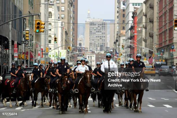 More than 75 mounted police from the U.S. And Canada ride from Chelsea Piers down Church St. To pay their respects at Ground Zero.