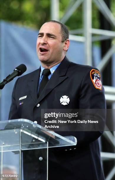 Firefighter John Picarello, a 19-year veteran from Staten Island's Battalion 21, speaks before a crowd of nearly 100,000 worshipers on the last day...